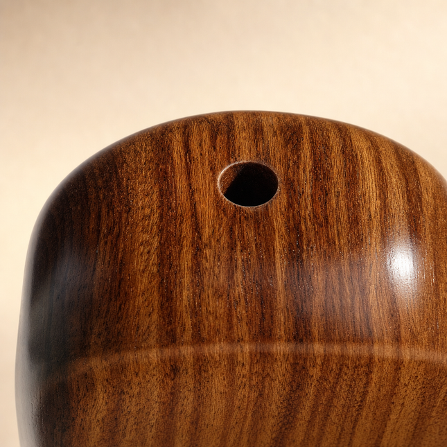 Close detail of the drilled bukhoor hole and figured walnut grain